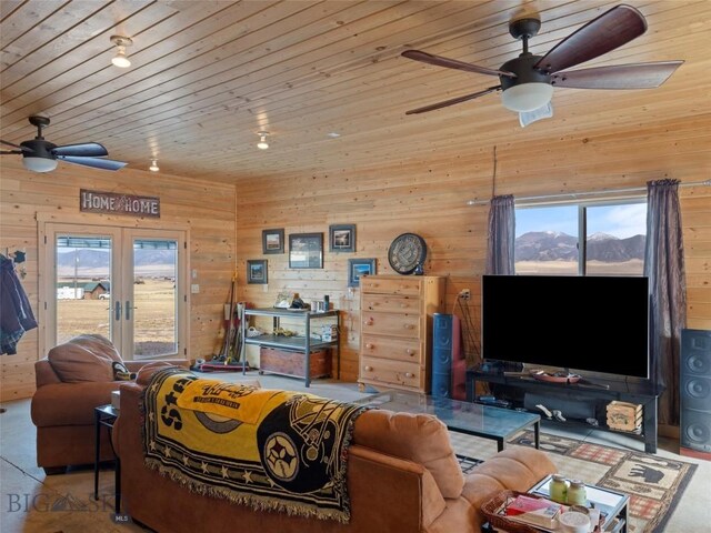 193 Tobe Rd, Ennis, MT 59729 - living area featuring ceiling fan, healthy amount of natural light, wooden ceiling, wooden walls, and french doors