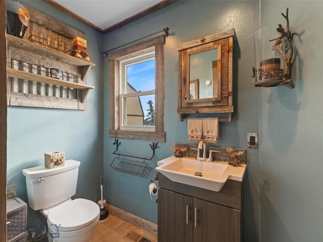 193 Tobe Rd, Ennis, MT 59729 - half bath with vanity, tile patterned floors, and crown molding