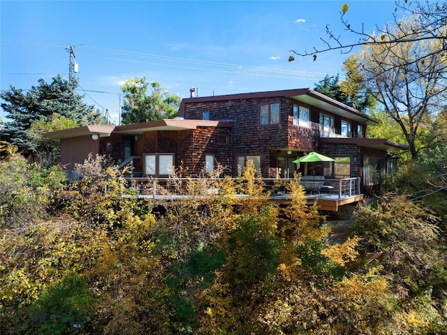 back of house with a sunroom