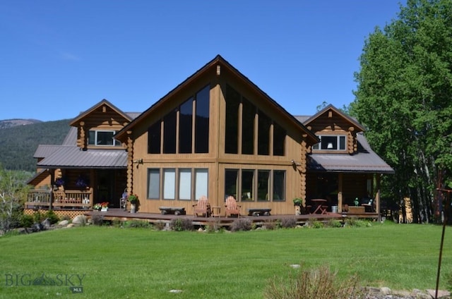 155 Moose Run, Polaris, MT 59746 - back of property featuring a porch, log siding, and a lawn