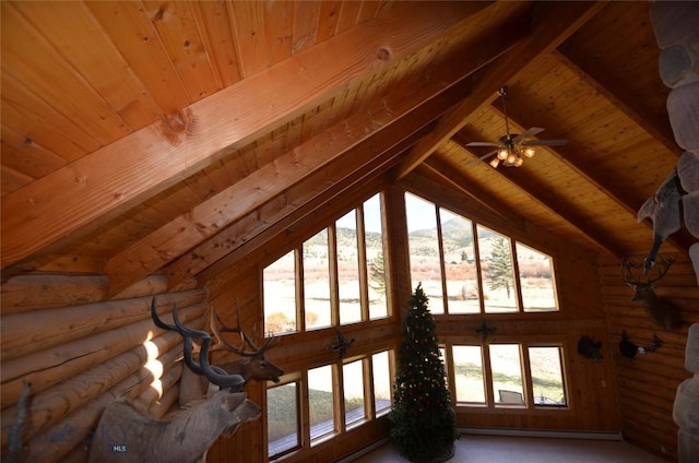155 Moose Run, Polaris, MT 59746 - unfurnished living room with a wood ceiling with exposed beams, a baseboard radiator, rustic walls, and carpet floors