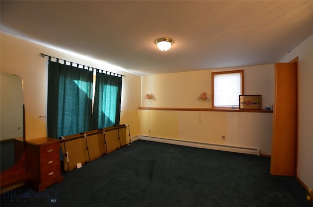 carpeted empty room featuring a baseboard radiator