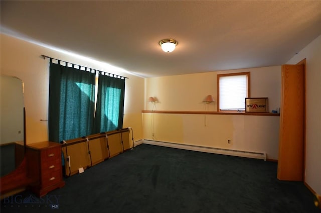 155 Moose Run, Polaris, MT 59746 - empty room featuring baseboard heating, dark colored carpet, and arched walkways