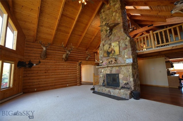 155 Moose Run, Polaris, MT 59746 - unfurnished living room featuring a wood ceiling with exposed beams, high vaulted ceiling, carpet floors, a stone fireplace, and a baseboard heating unit
