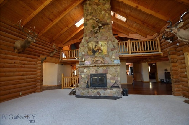 155 Moose Run, Polaris, MT 59746 - unfurnished living room featuring high vaulted ceiling, carpet floors, a wood ceiling with exposed beams, and a stone fireplace