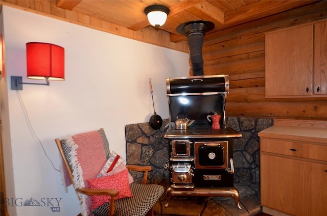 155 Moose Run, Polaris, MT 59746 - living area with a wooden ceiling with exposed beams and a wood stove
