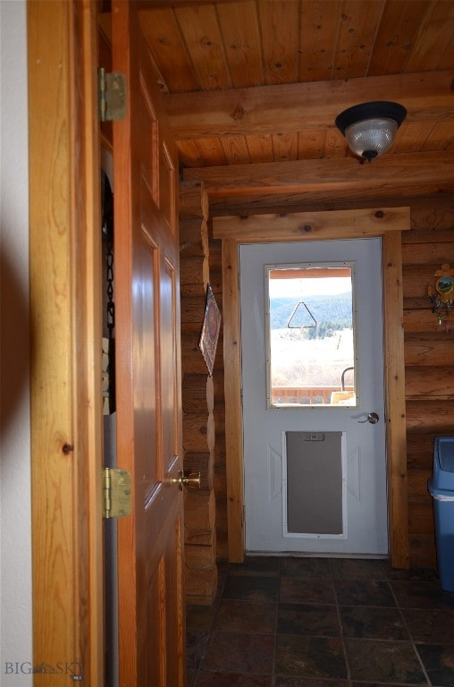 doorway to outside with beam ceiling, wooden ceiling, and rustic walls