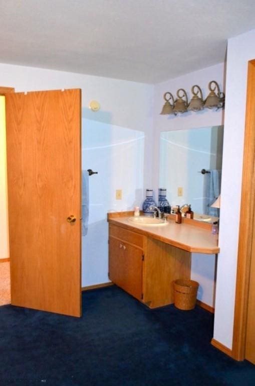 155 Moose Run, Polaris, MT 59746 - bathroom featuring vanity and baseboards