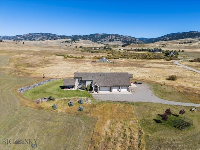 birds eye view of property with a rural view and a mountain view