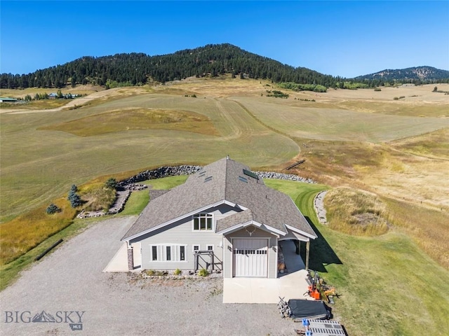 birds eye view of property with a mountain view