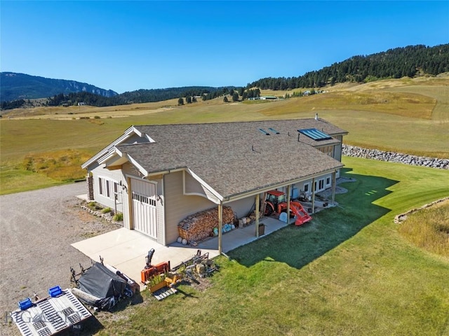 bird's eye view featuring a rural view and a mountain view