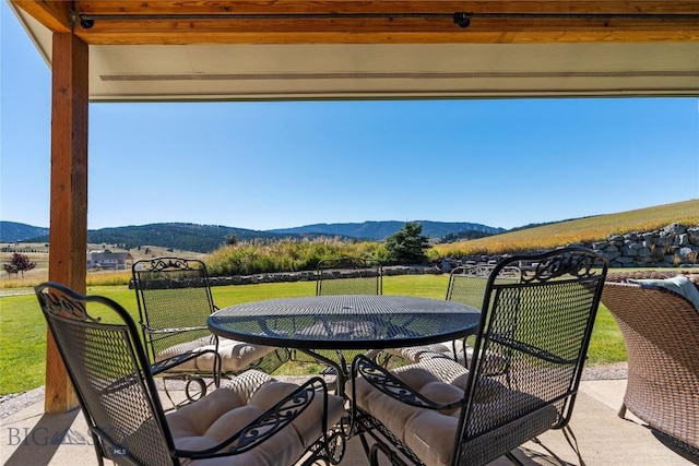 view of patio / terrace featuring a mountain view