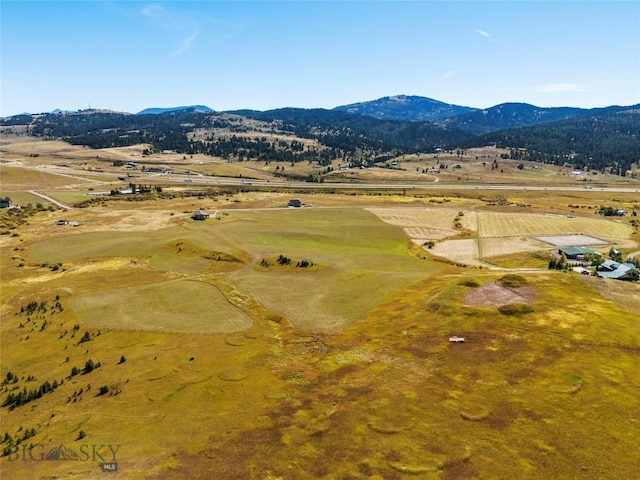 birds eye view of property with a rural view and a mountain view