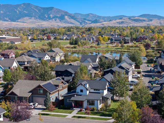 bird's eye view featuring a water and mountain view