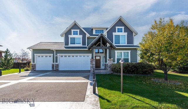 craftsman-style house featuring a garage and a front lawn