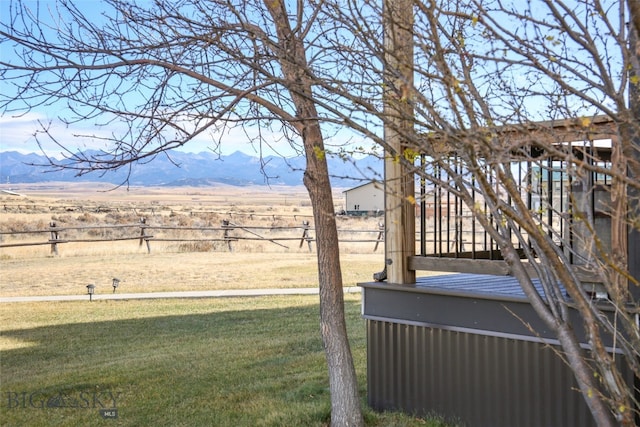 view of yard featuring a mountain view and a rural view