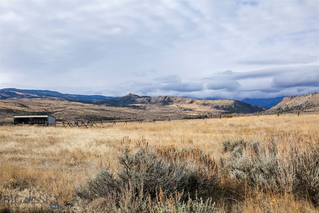 property view of mountains featuring a rural view