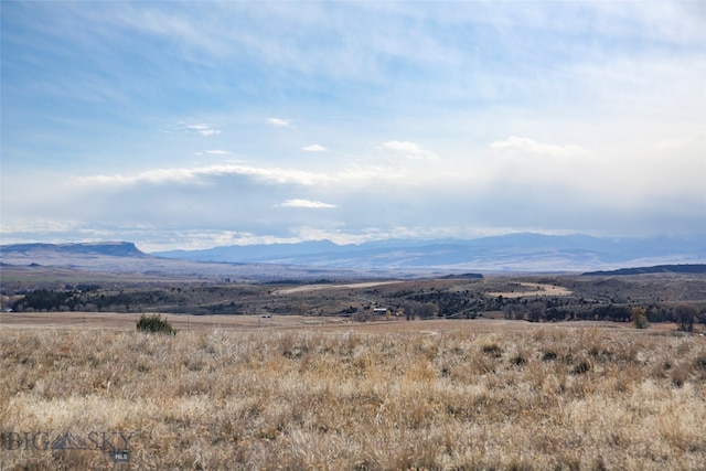 mountain view featuring a rural view