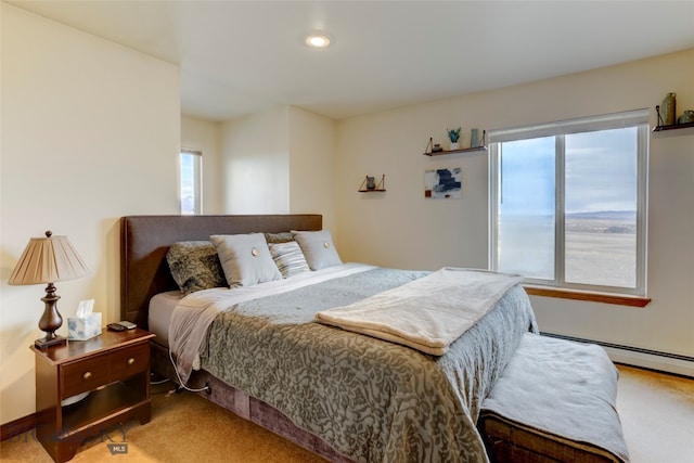 bedroom featuring carpet and baseboard heating