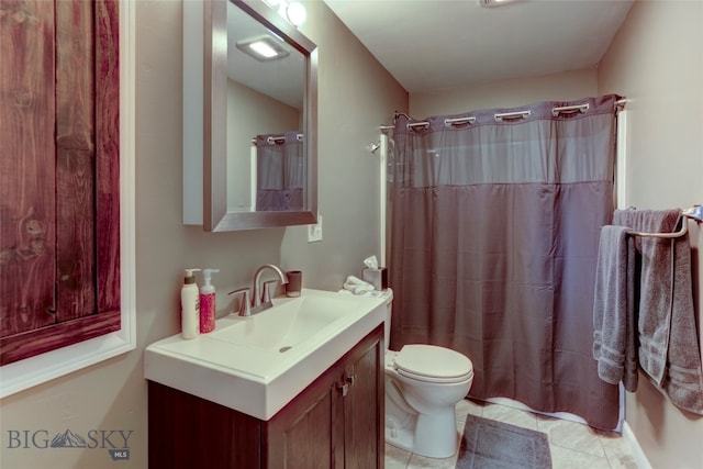 bathroom featuring vanity, toilet, tile patterned floors, and a shower with shower curtain