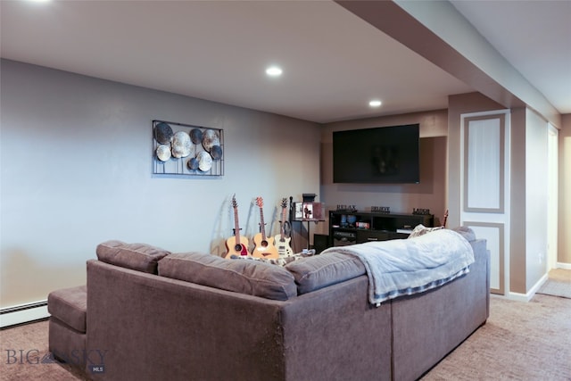 carpeted living room with a baseboard heating unit