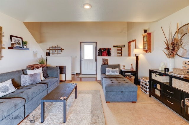 carpeted living room featuring a baseboard radiator