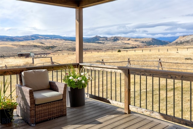 deck with a mountain view and a rural view