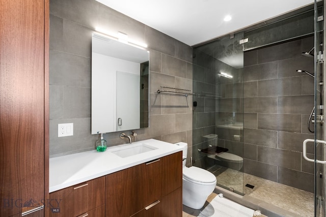 bathroom featuring tile walls, toilet, walk in shower, decorative backsplash, and vanity