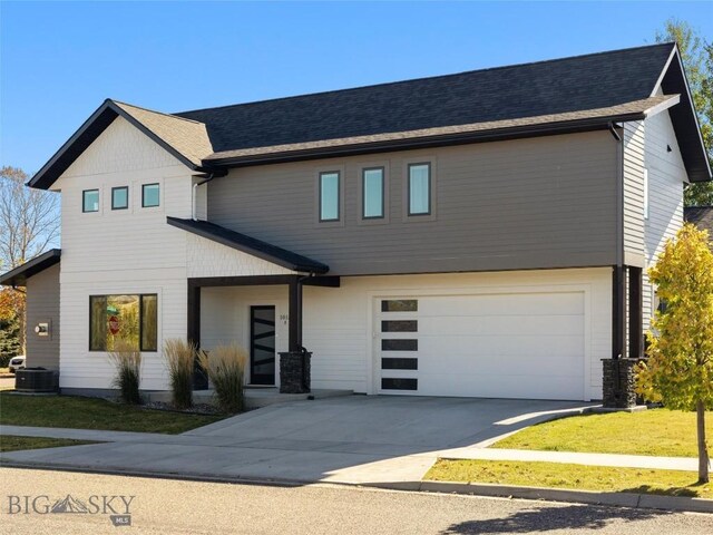 1015 Golden Gate Ave Unit A, Bozeman, MT 59718 - view of front of house with a garage, driveway, a front yard, and central AC unit