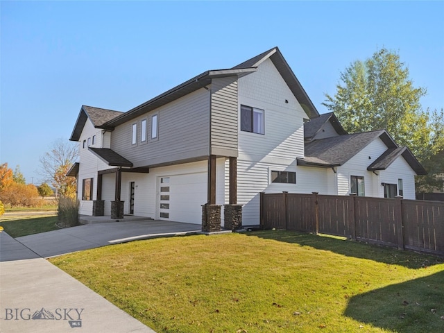 view of home's exterior featuring a yard and a garage