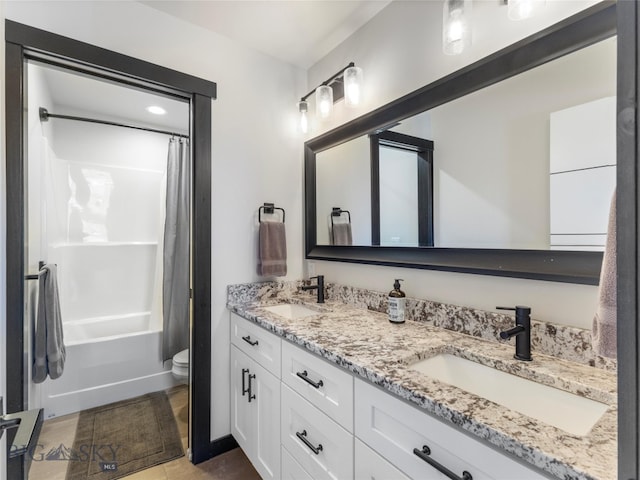 full bathroom featuring vanity, tile patterned floors, toilet, and shower / bathtub combination with curtain