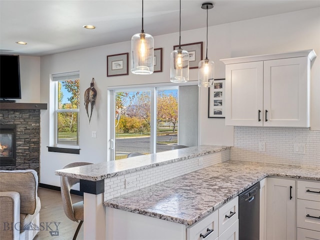 kitchen featuring white cabinets and plenty of natural light