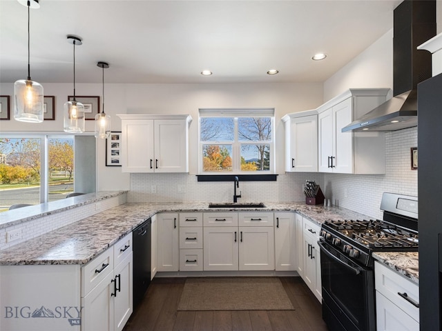 kitchen with wall chimney range hood, dark wood-type flooring, sink, black appliances, and white cabinets