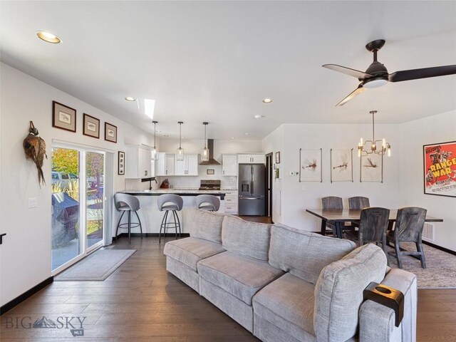 1015 Golden Gate Ave Unit A, Bozeman, MT 59718 - living area with a chandelier, dark wood-style floors, recessed lighting, baseboards, and ceiling fan