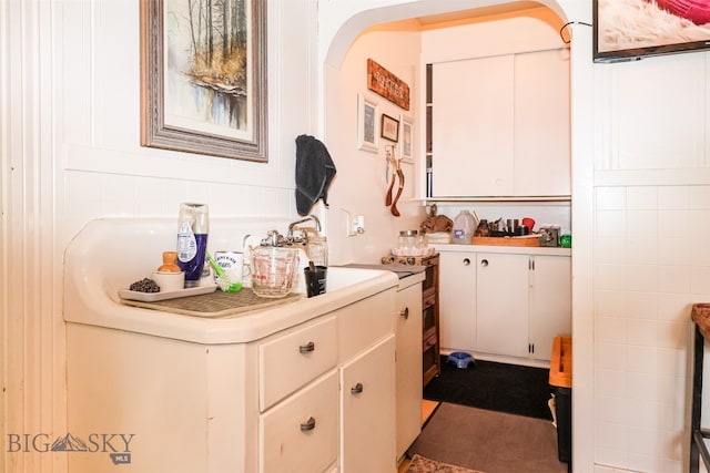 bar featuring white cabinets