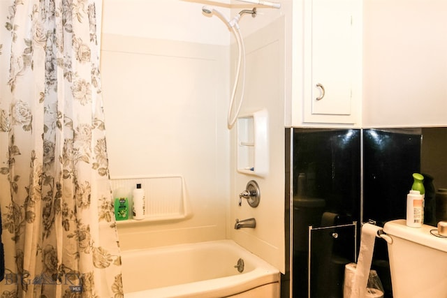 bathroom with toilet and shower / bathtub combination with curtain