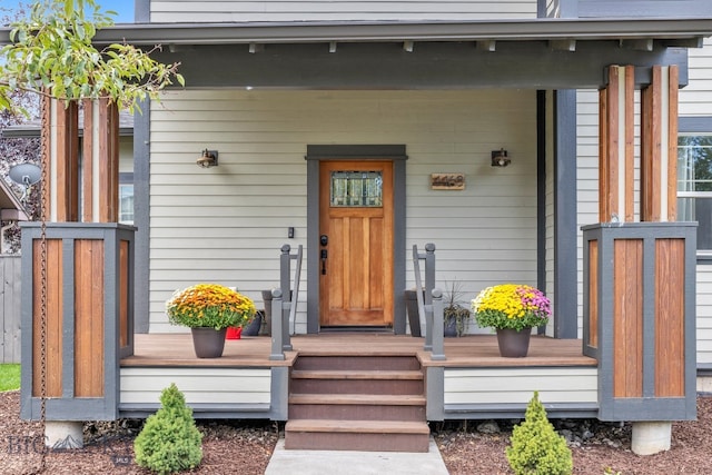 entrance to property featuring covered porch