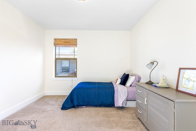 bedroom with light colored carpet