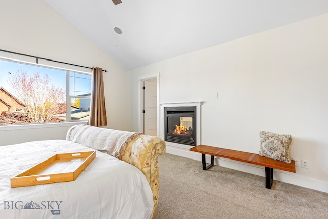 carpeted bedroom featuring high vaulted ceiling