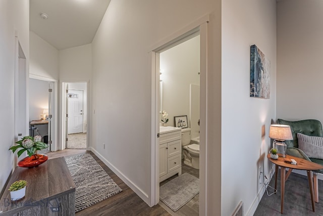 corridor featuring dark wood-type flooring