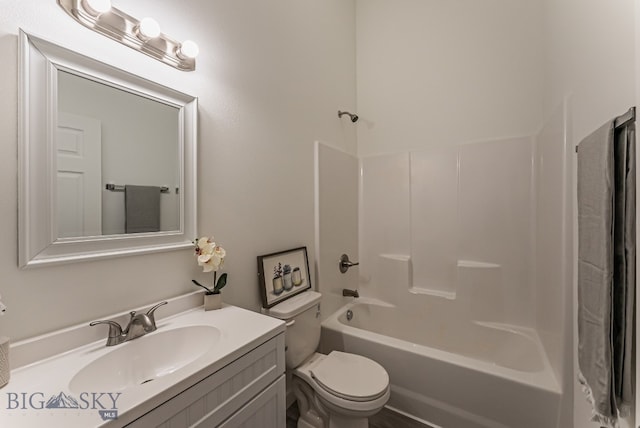 full bathroom with toilet, vanity, and tub / shower combination