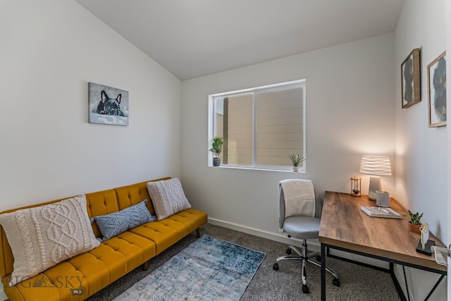 home office featuring vaulted ceiling and carpet flooring