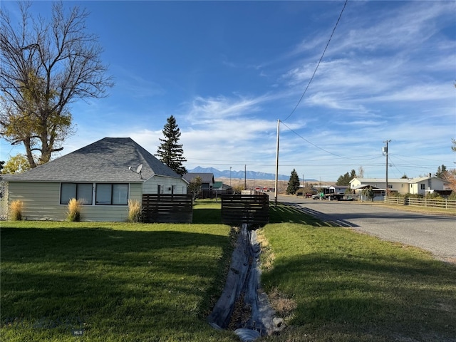 view of property exterior featuring a lawn