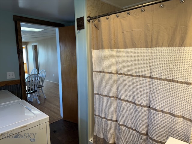 bathroom with a shower with curtain and hardwood / wood-style flooring