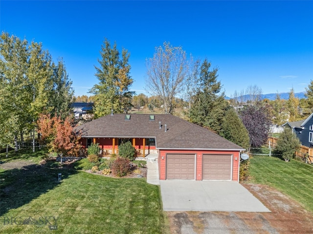 single story home featuring a front lawn and a garage