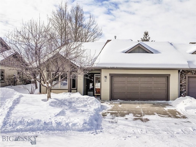 ranch-style home featuring a garage