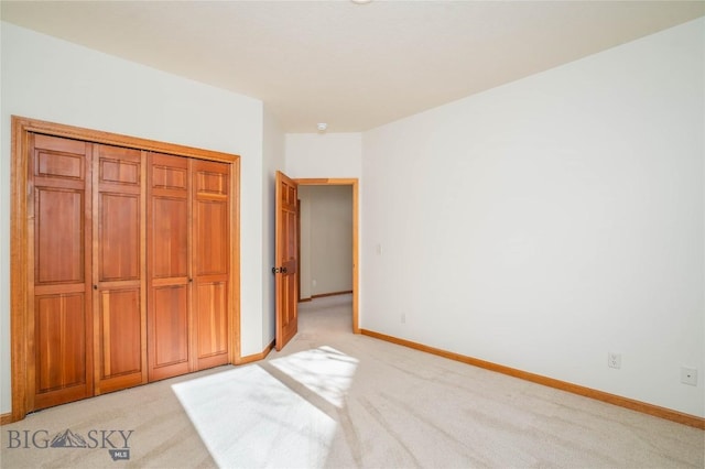 unfurnished bedroom with light colored carpet