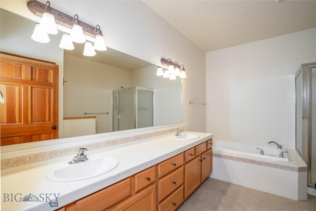 bathroom with vanity and independent shower and bath