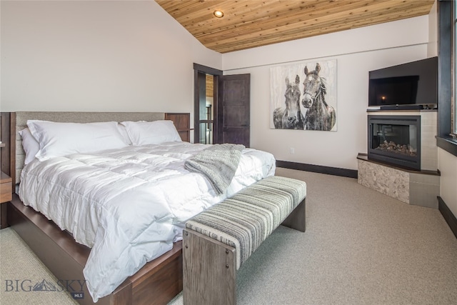 bedroom featuring light colored carpet, wood ceiling, and vaulted ceiling