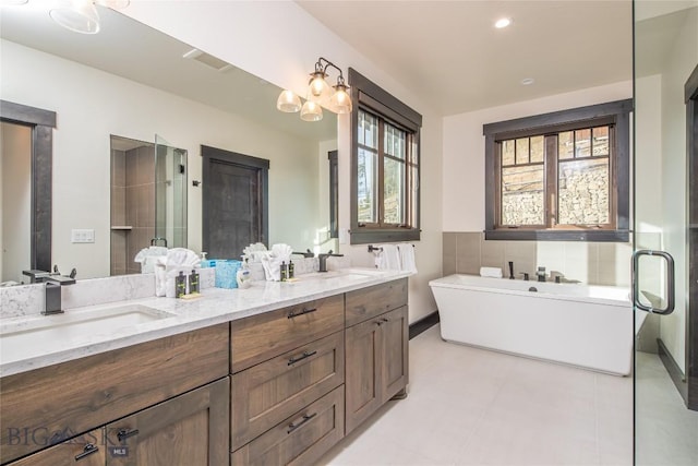 7 Lower Cascade Ridge Rd Unit 103, Big Sky, MT 59716 - bathroom with double vanity, a freestanding tub, and a shower with door